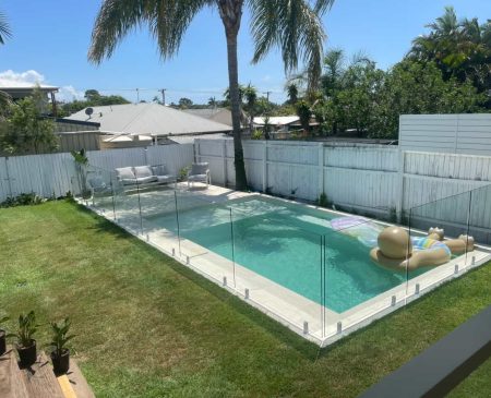 margate-swimming-pool-1 Stunning backyard swimming pool with a floating pool lounge and a glass pool fence