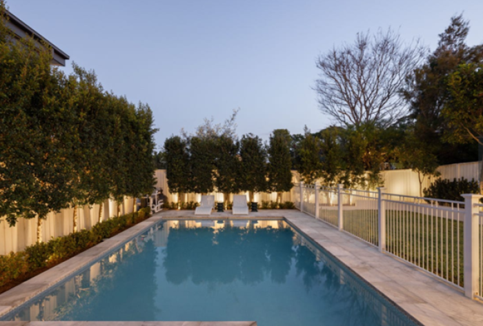 Sensational luxury swimming pool surrounded by landscaped gardens and exquisite lighting