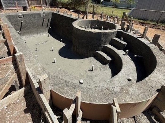 What is going to be a sensational backyard swimming pool in the first stages of construction